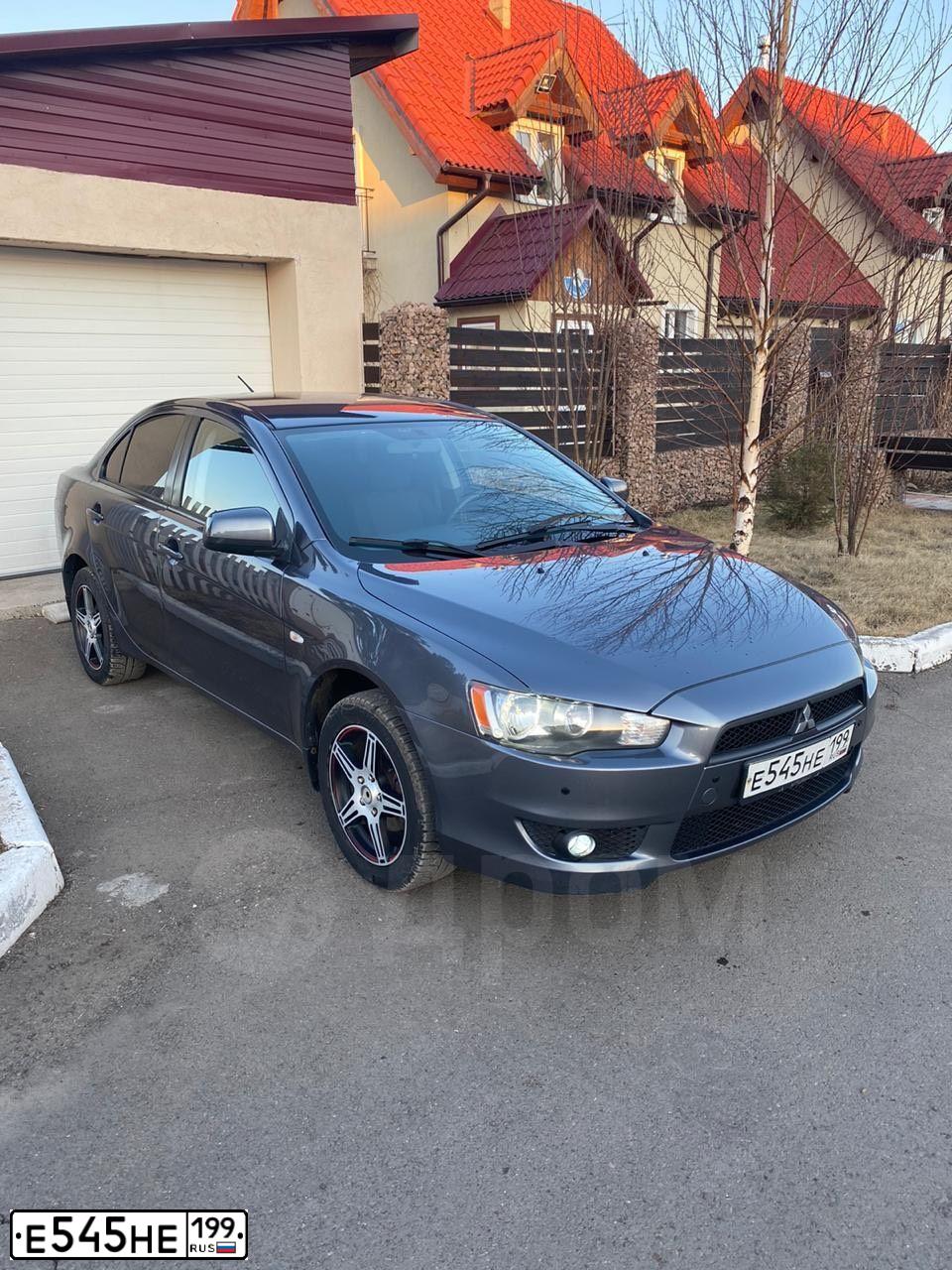 Фото автомобиля MITSUBISHI LANCER, 2008 — госномер Н295КО19. Цвет: Серый