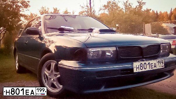 Фото автомобиля MITSUBISHI DIAMANTE, 1993 — госномер Е732МХ33. Цвет: Темно-зеленый