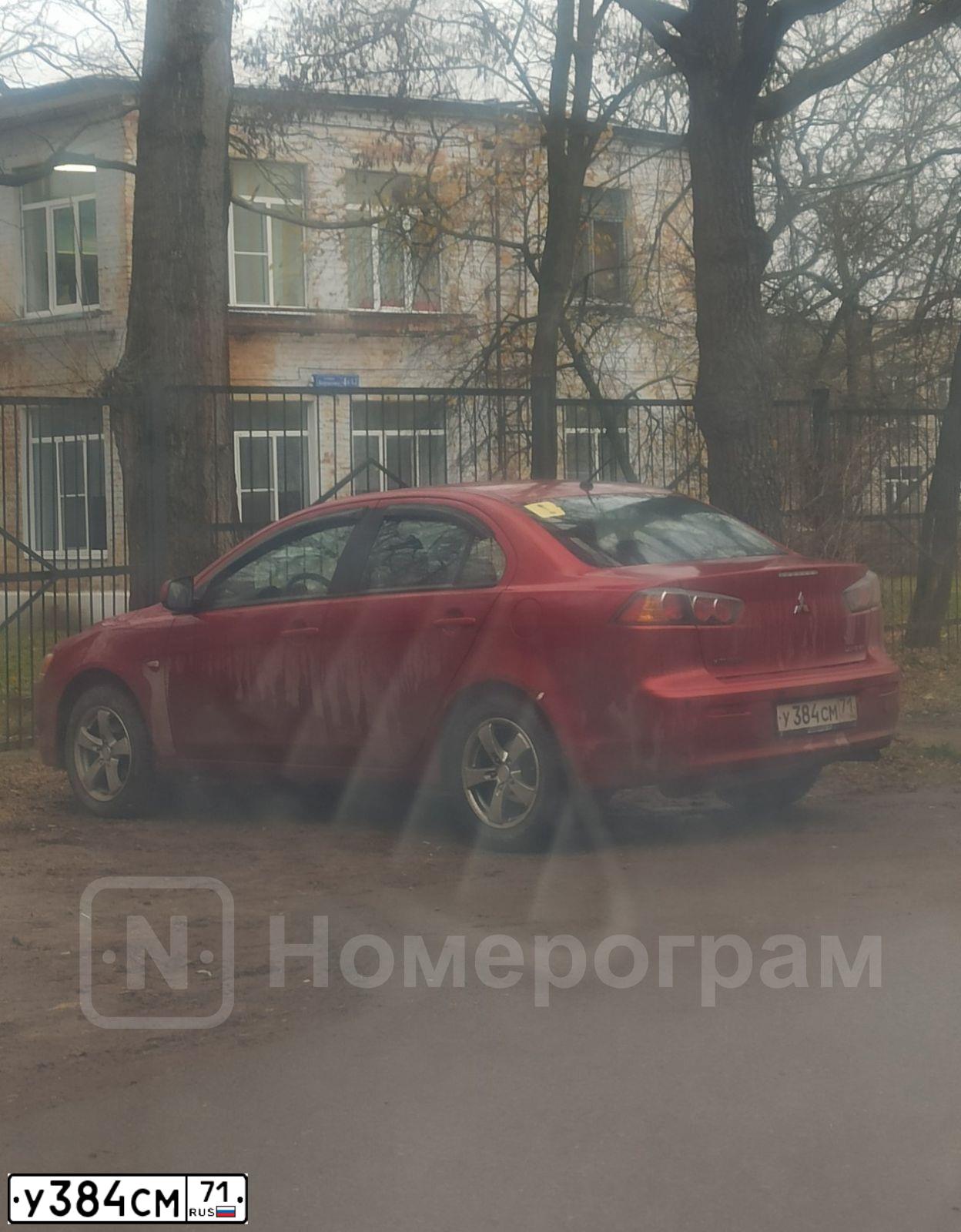 Фото автомобиля MITSUBISHI LANCER, 2010 — госномер У384СМ71. Цвет: Красный