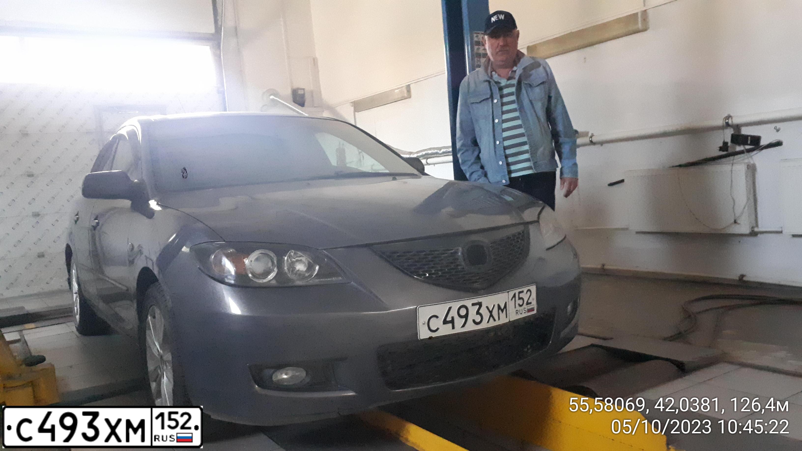 Фото автомобиля MAZDA 3, 2006 — госномер Н463СО702. Цвет: СЕРЫЙ