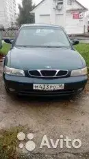 Фото автомобиля DAEWOO NUBIRA, 1998 — госномер М027ММ18. Цвет: ЗЕЛЕНЫЙ