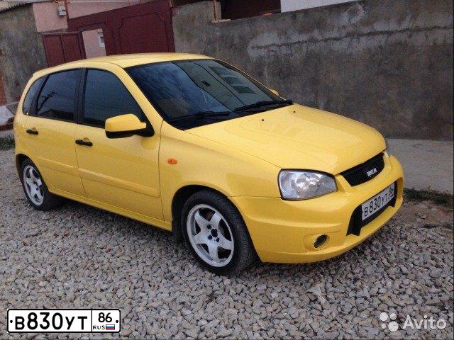 Фото автомобиля LADA KALINA, 2010 — госномер Т308НМ73. Цвет: ЖЕЛТЫЙ