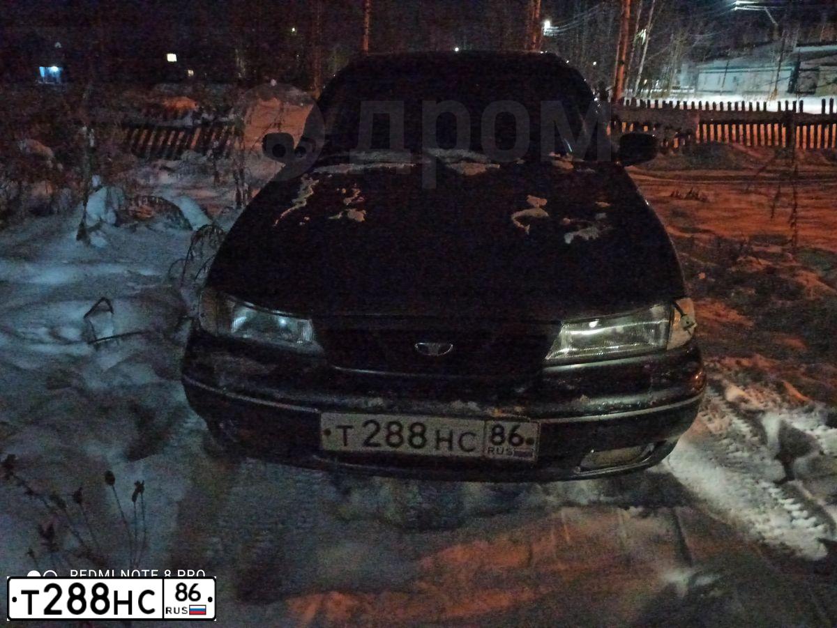 Фото автомобиля DAEWOO NEXIA, 2004 — госномер Т288НС86. Цвет: СЕРО-ЗЕЛЕНЫЙ