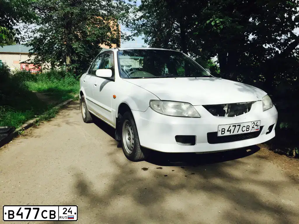 Фото автомобиля MAZDA FAMILIA, 2000 — госномер В477СВ24
