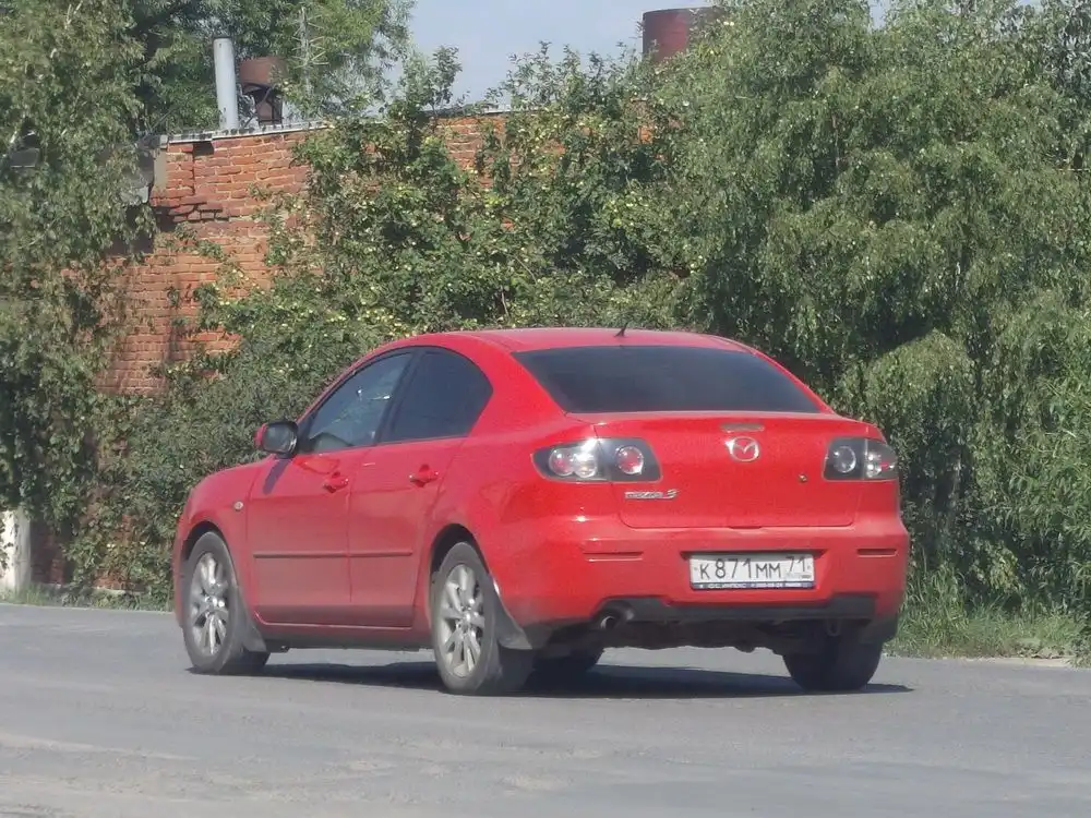 Фото автомобиля MAZDA 3, 2007 — госномер К871ММ71. Цвет: КРАСНЫЙ