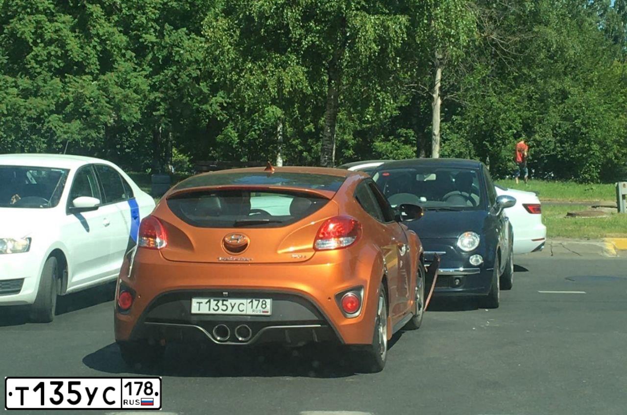 Фото автомобиля HYUNDAI VELOSTER, 2015 — госномер К587ВВ147. Цвет: Оранжевый