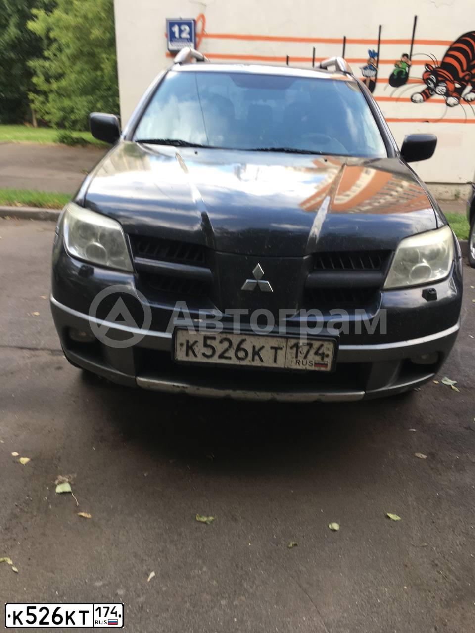 Фото автомобиля MITSUBISHI OUTLANDER, 2006 — госномер К526КТ174. Цвет: ЧЕРНЫЙ