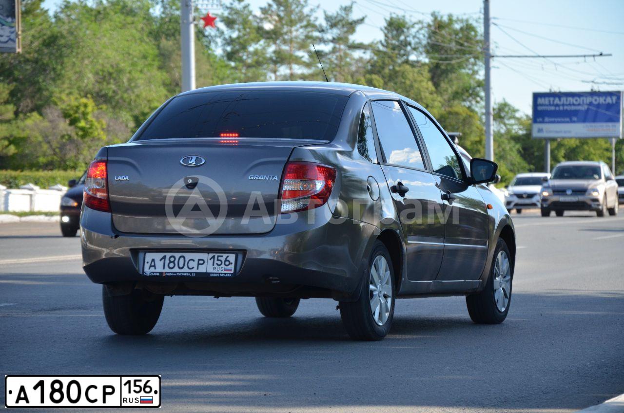 Фото автомобиля LADA 2190 GRANTA, 2017 — госномер А180СР156. Цвет: золотисто коричневый