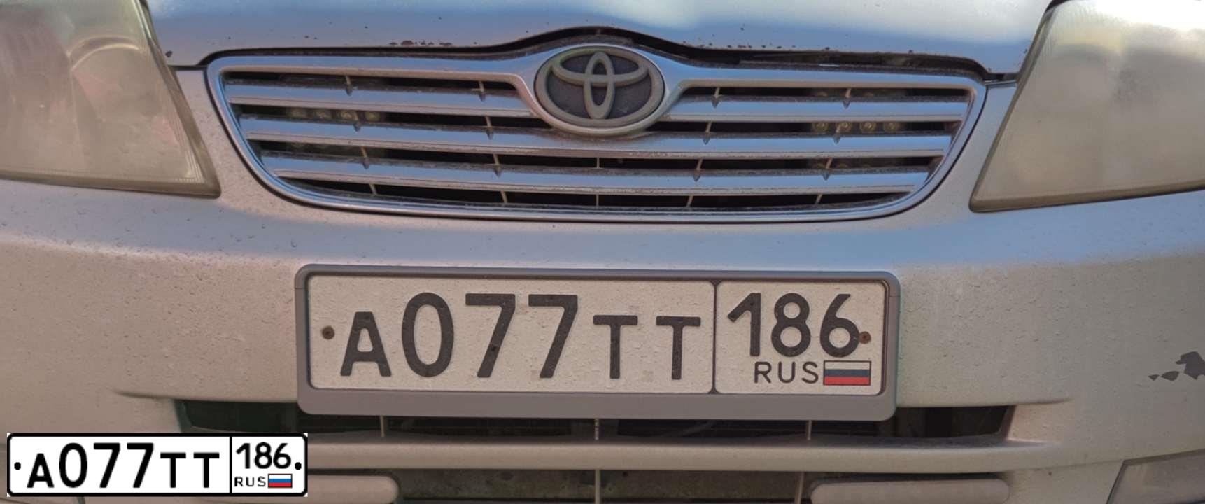 Фото автомобиля TOYOTA COROLLA, 2004 — госномер А077ТТ186. Цвет: Серебристый