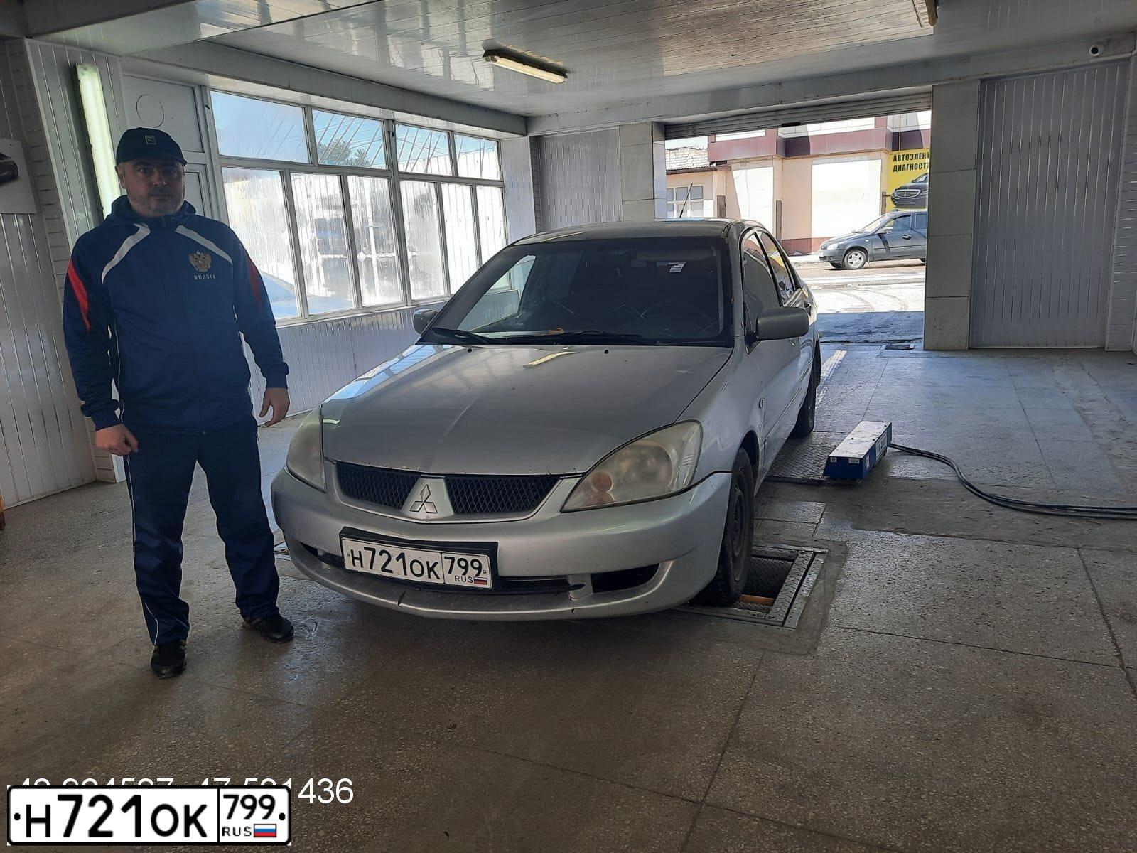 Фото автомобиля MITSUBISHI LANCER, 2005 — госномер У111ОА750. Цвет: Серебристый