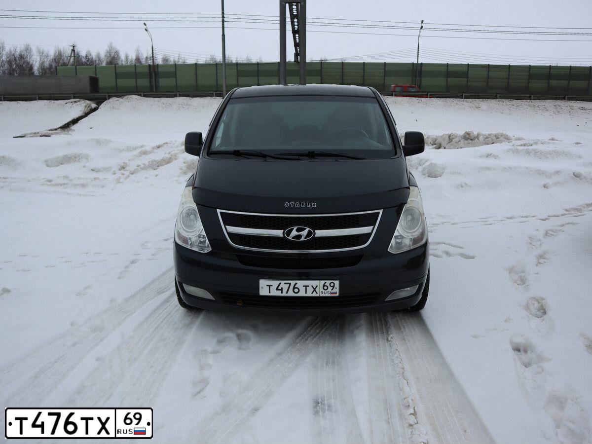 Фото автомобиля HYUNDAI GRAND STAREX, 2008 — госномер Т041СА69. Цвет: ЧЕРНЫЙ