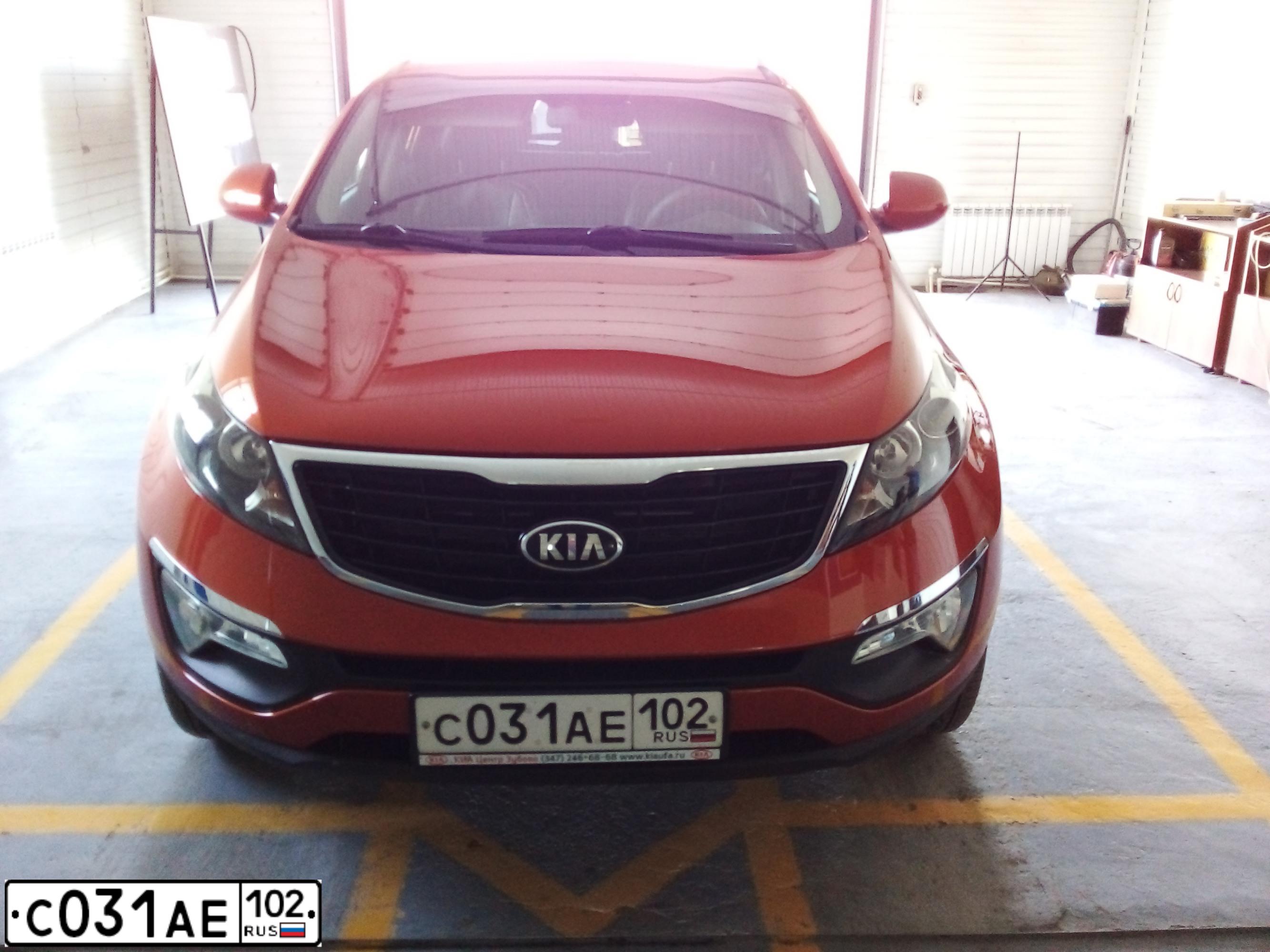 Фото автомобиля KIA SPORTAGE, 2014 — госномер С031АЕ102. Цвет: ОРАНЖЕВЫЙ
