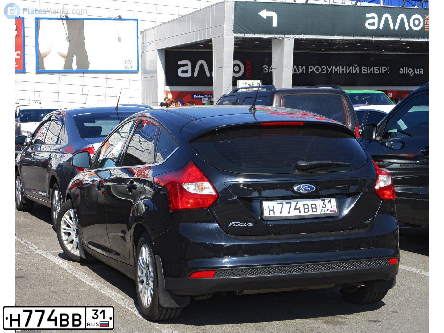 Фото автомобиля FORD FOCUS, 2012 — госномер Н774ВВ31. Цвет: ЧЕРНЫЙ