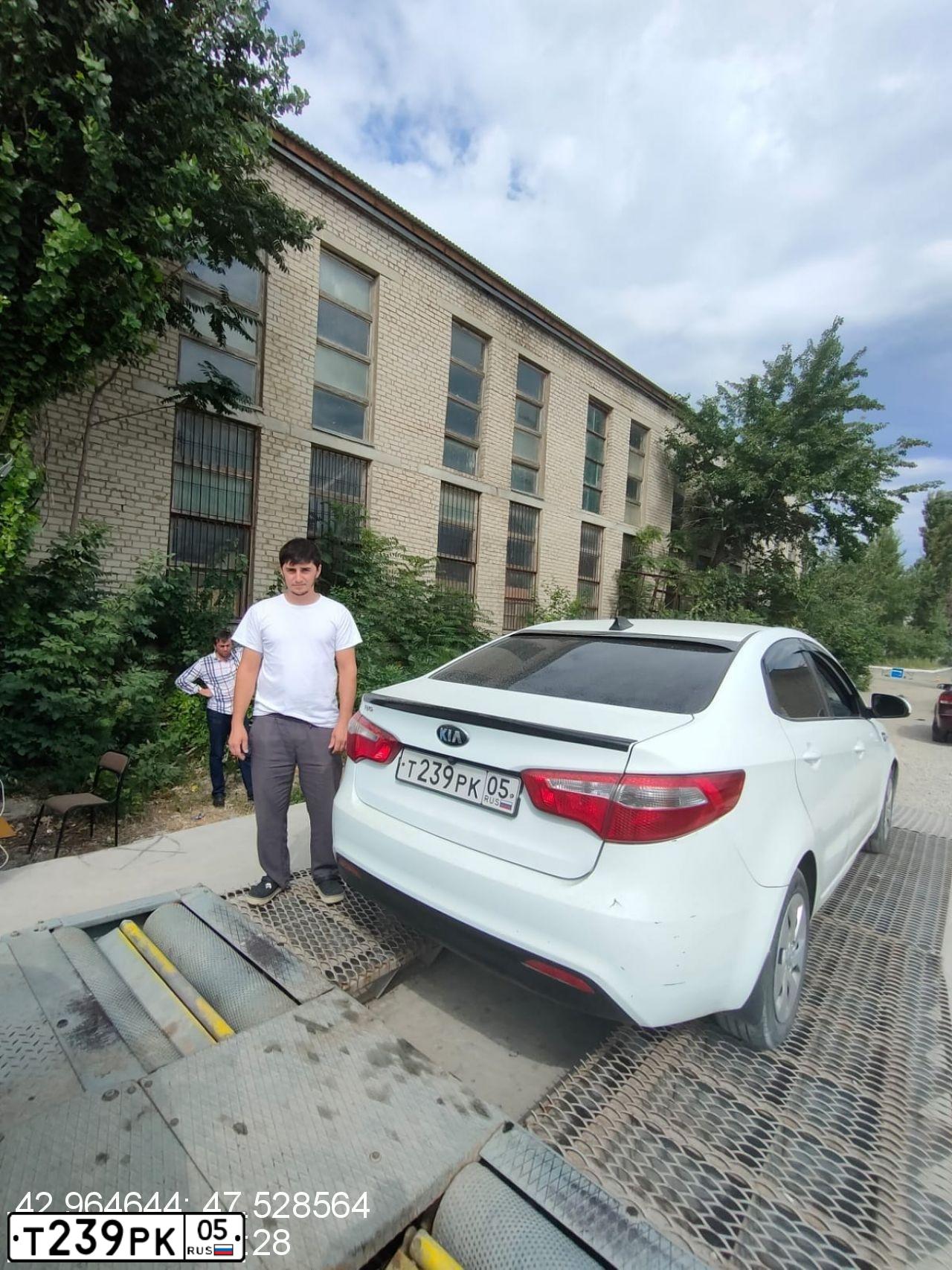 Фото автомобиля KIA RIO, 2013 — госномер Н720ЕТ05. Цвет: Белый