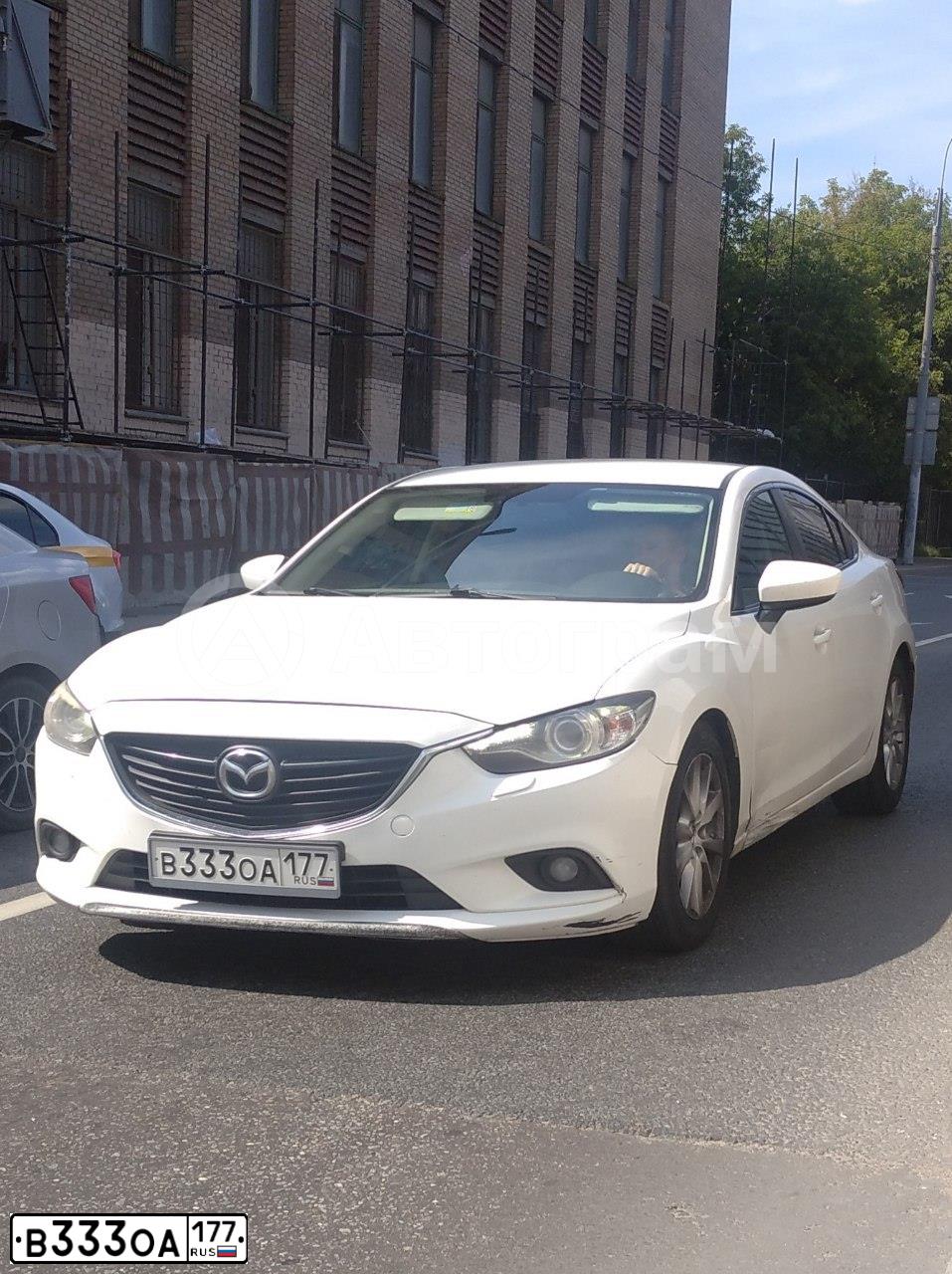 Фото автомобиля OPEL ASTRA, 2013 — госномер Т490КО777. Цвет: БЕЛЫЙ