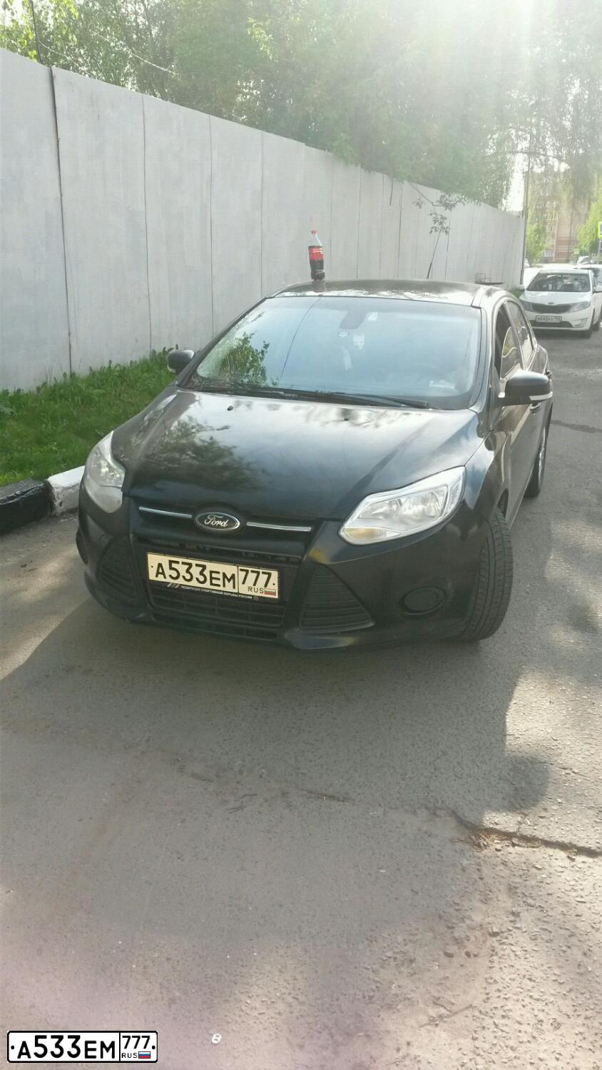 Фото автомобиля FORD FOCUS, 2011 — госномер К496НА51. Цвет: ЧЕРНЫЙ