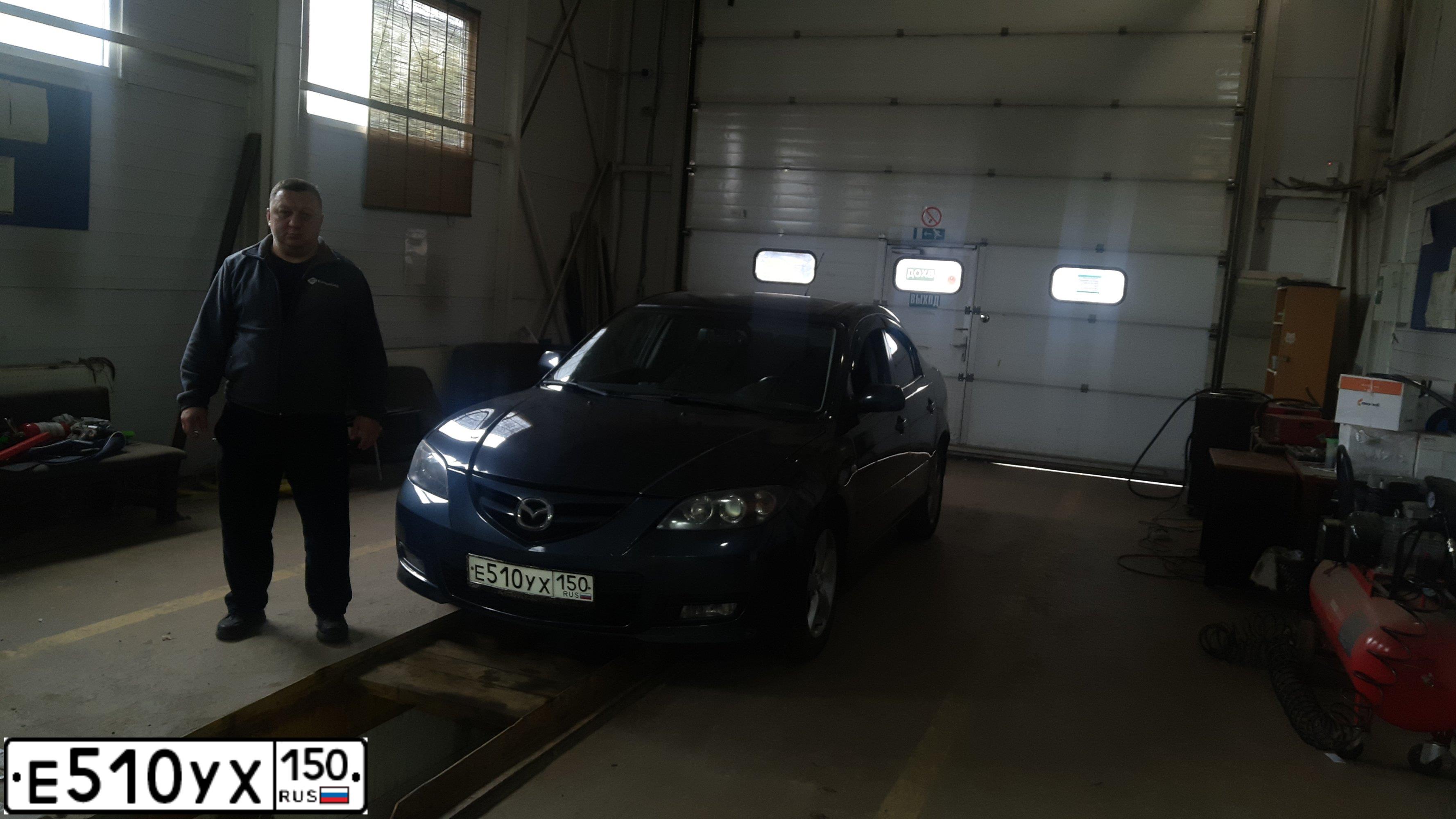 Фото автомобиля MAZDA 3, 2005 — госномер Е510УХ150. Цвет: СЕРЫЙ ТЕМНЫЙ