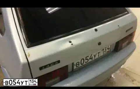 Фото автомобиля LADA 2114 SAMARA, 2005 — госномер В054УТ134. Цвет: Серебристо-желто-голубой