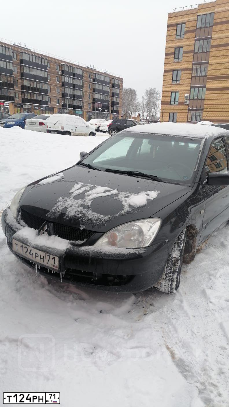 Фото автомобиля MITSUBISHI LANCER, 2007 — госномер Т124РН71. Цвет: ЧЕРНЫЙ