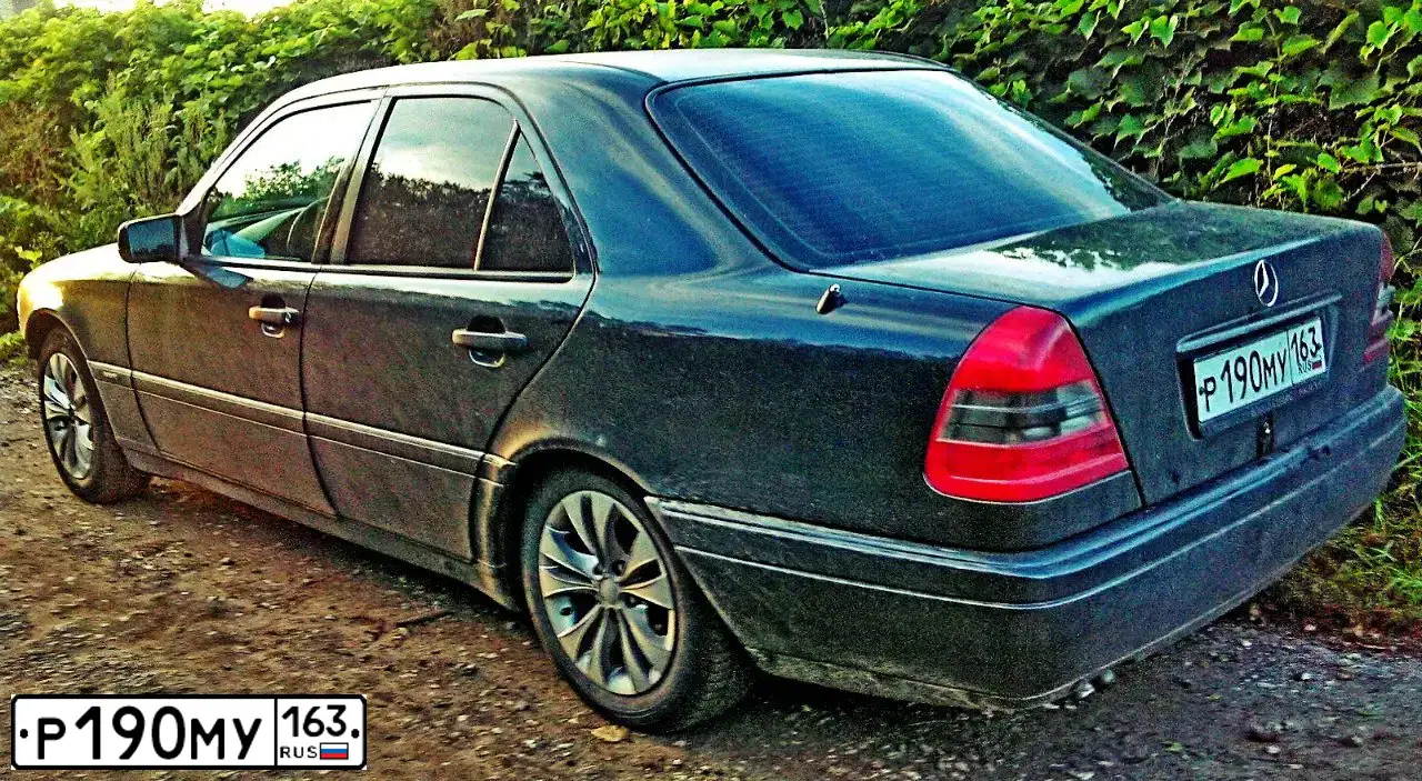 Фото автомобиля MERCEDES C-KLASSE, 1994 — госномер О310СТ123. Цвет: ТЕМНО-СЕРЫЙ