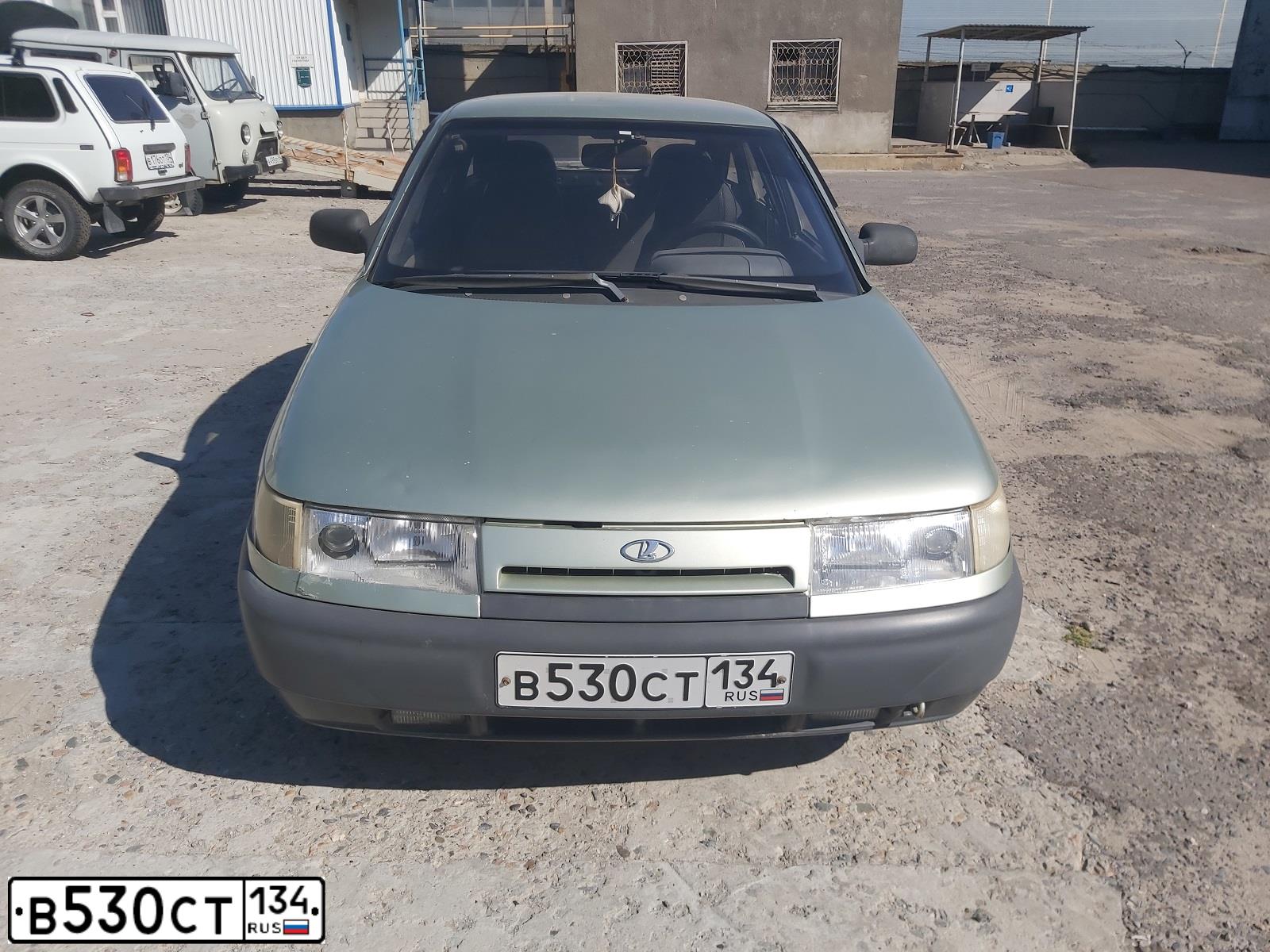 Фото автомобиля LADA 2112, 2001 — госномер К243ОТ34. Цвет: СВЕТЛО-ЗЕЛЕНЫЙ