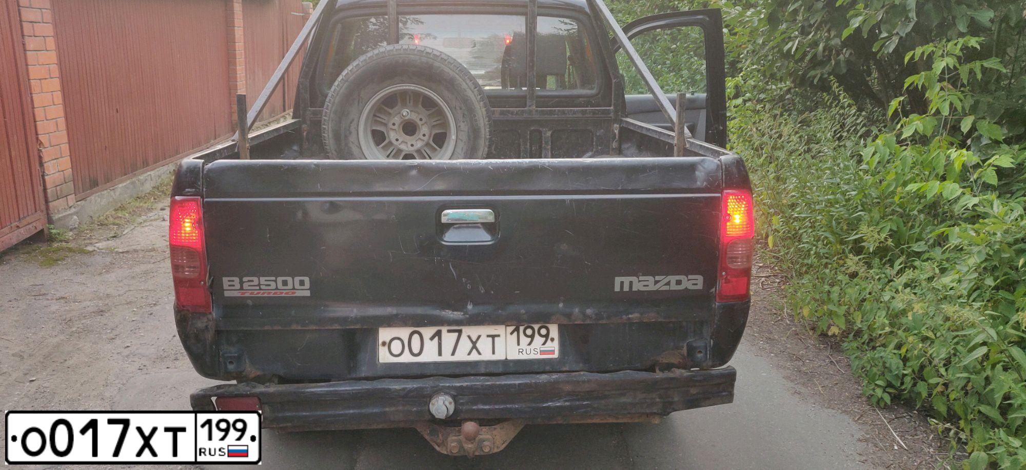 Фото автомобиля MAZDA B-SERIE, 2005 — госномер М211УА69. Цвет: ЧЕРНЫЙ