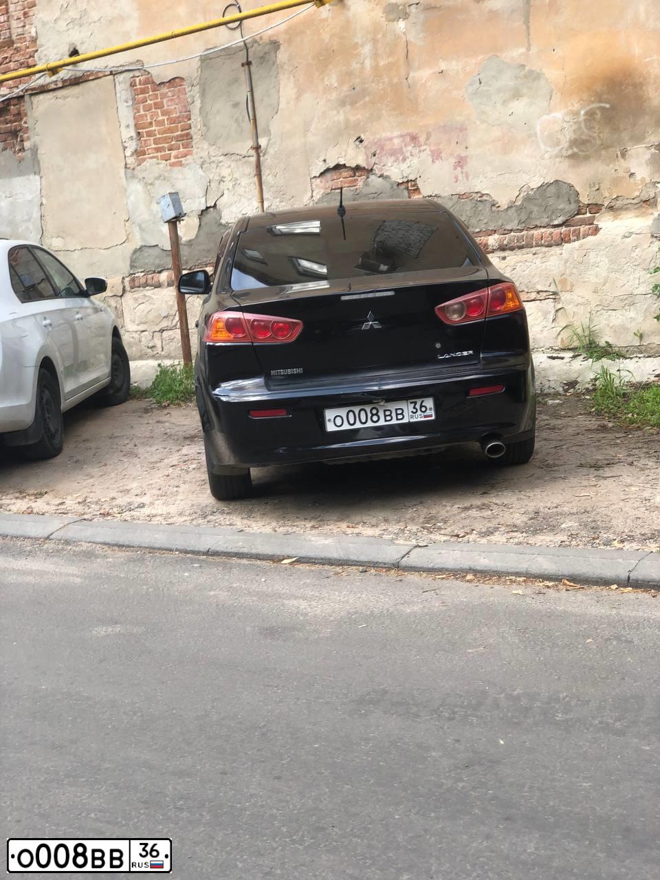 Фото автомобиля MITSUBISHI LANCER, 2008 — госномер О008ВВ36. Цвет: ЧЕРНЫЙ