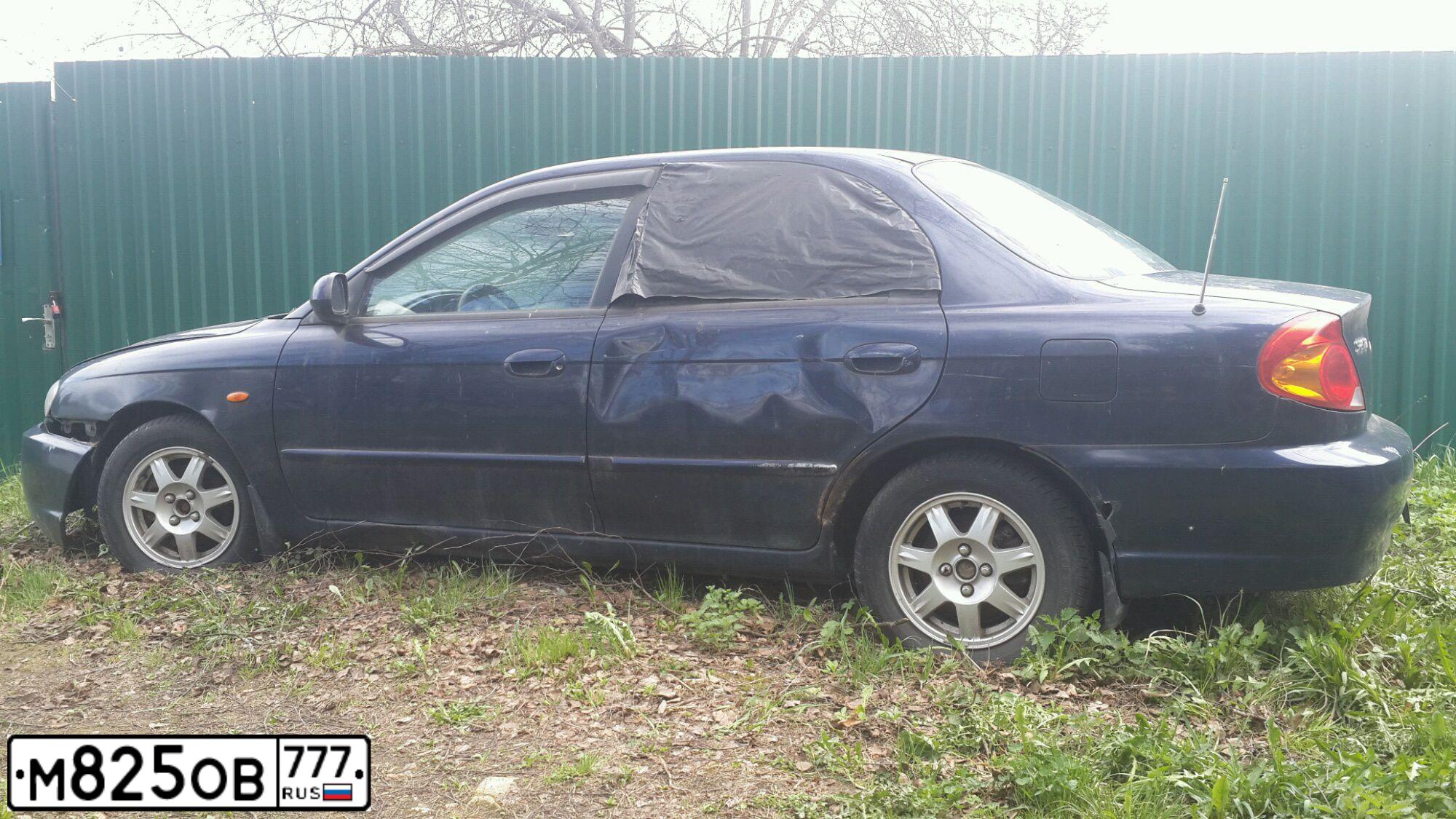 Фото автомобиля KIA SPECTRA, 2009 — госномер М825ОВ777. Цвет: ТЕМНО-СИНИЙ