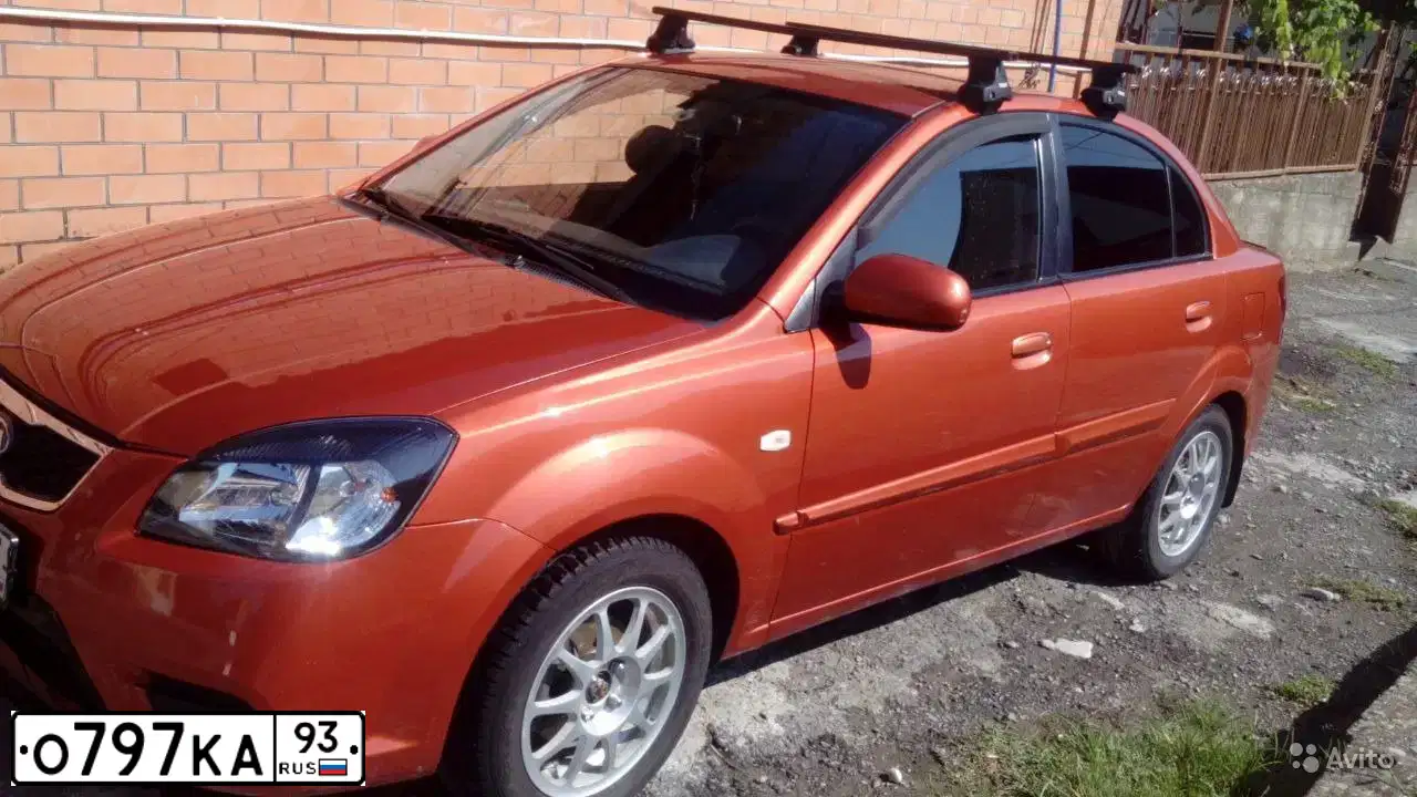 Фото автомобиля KIA RIO, 2011 — госномер Н644МВ82. Цвет: Оранжевый