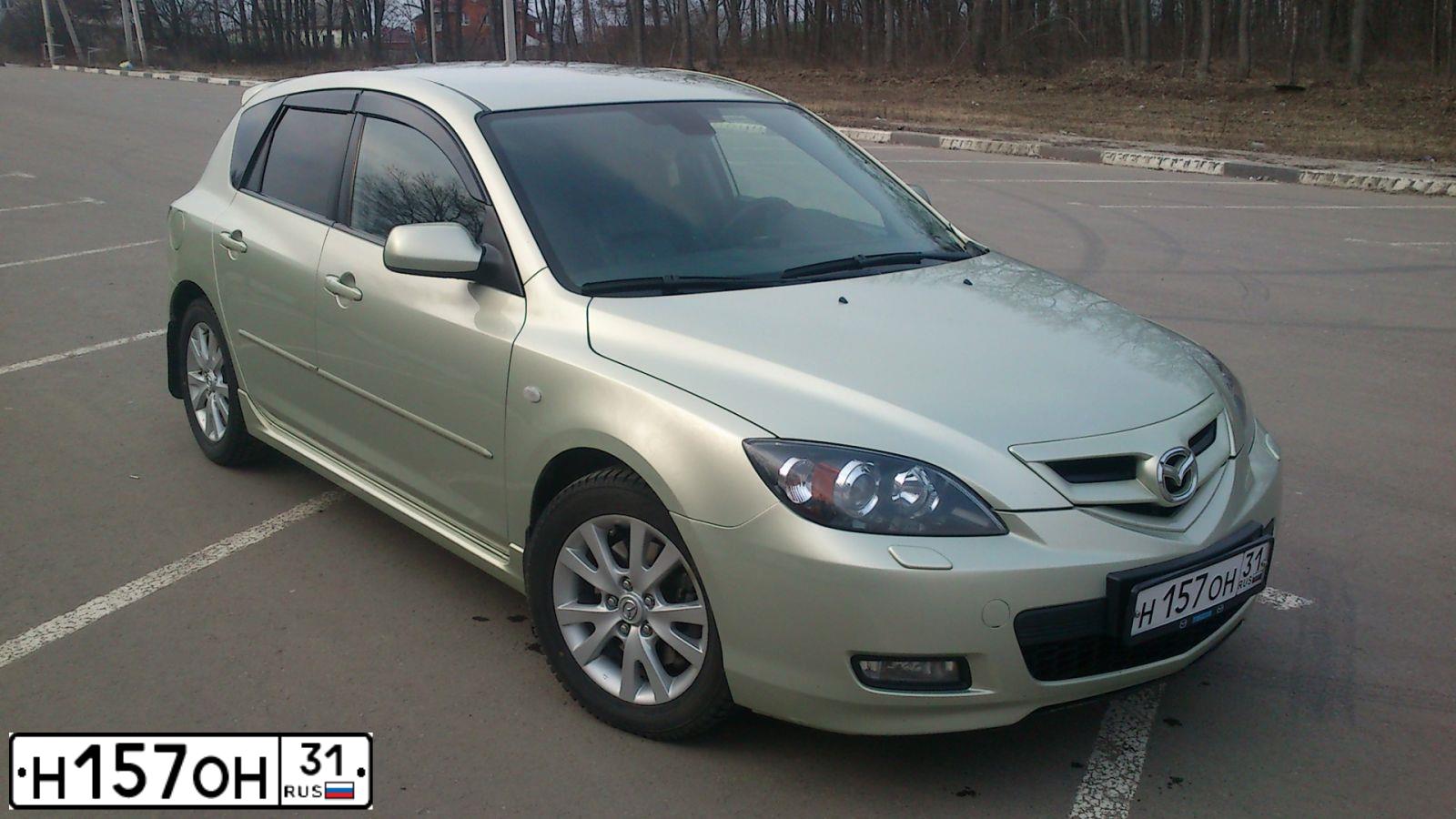 Фото автомобиля MAZDA 3, 2008 — госномер Н157ОН31. Цвет: ЗОЛОТИСТЫЙ