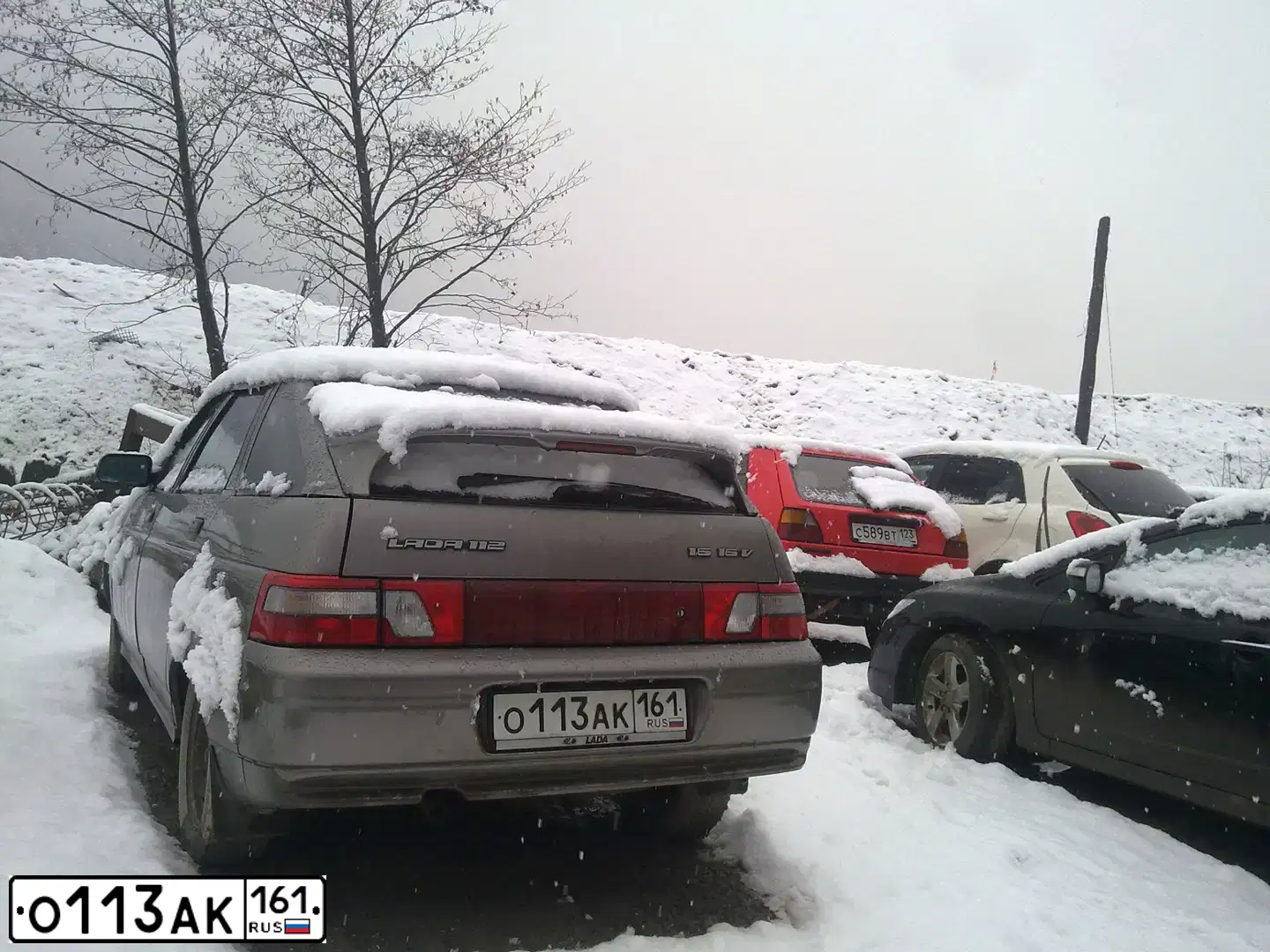 Фото автомобиля LADA 2112, 2007 — госномер О113АК161. Цвет: С.КОРИЧНЕВЫЙ