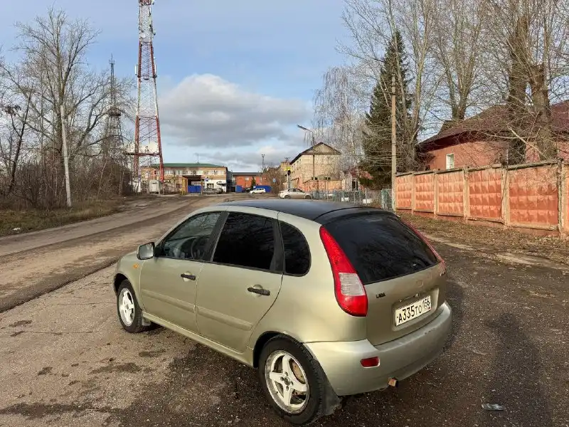 Фото автомобиля LADA 1119 KALINA, 2011 — госномер А335ТО156. Цвет: БЕЛО-ЖЕЛТЫЙ ПЕРЛАМУТРОВЫЙ