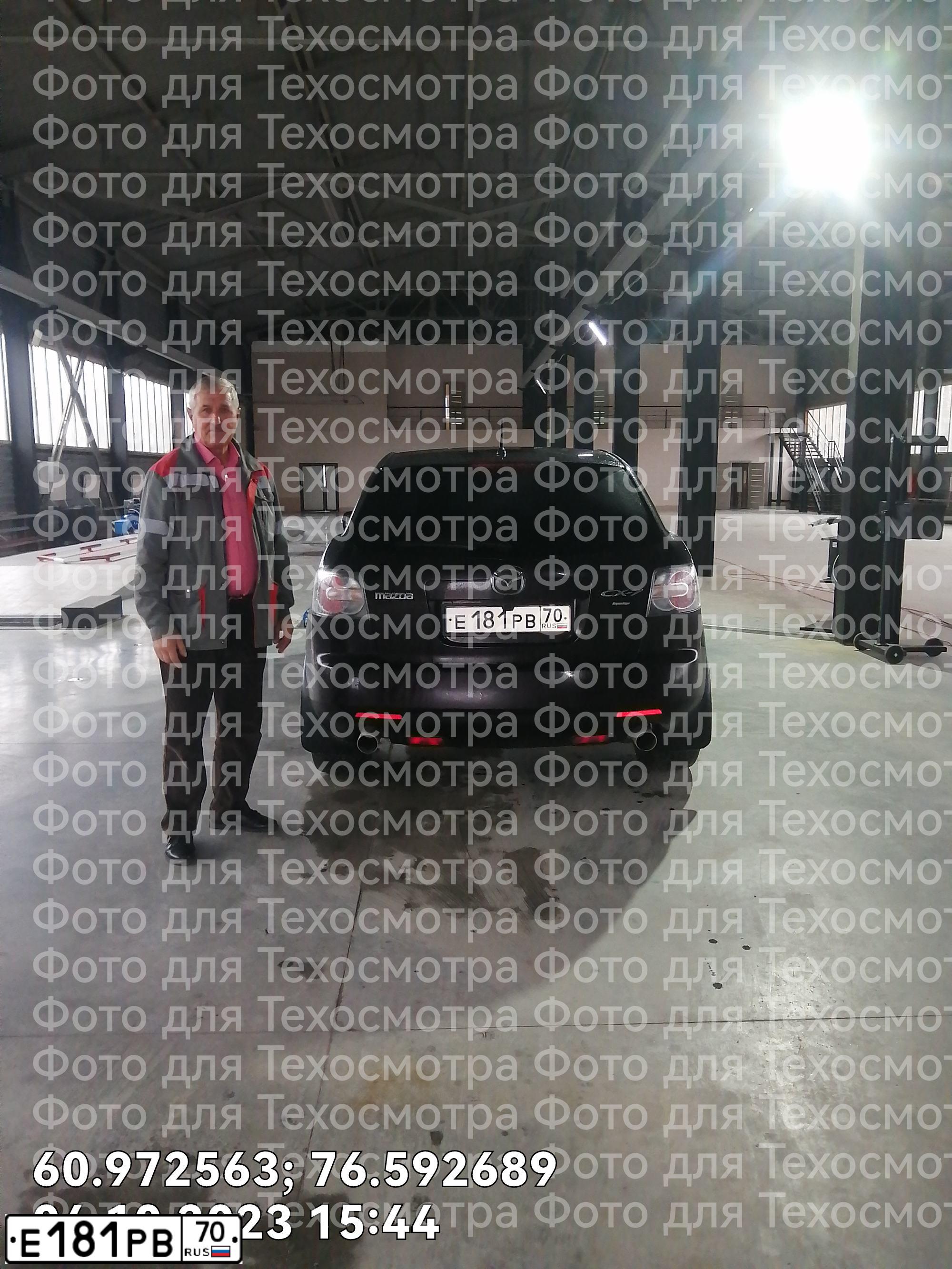 Фото автомобиля MAZDA CX-7, 2007 — госномер Е181РВ70. Цвет: ТЕМНО-ВИШНЕВЫЙ