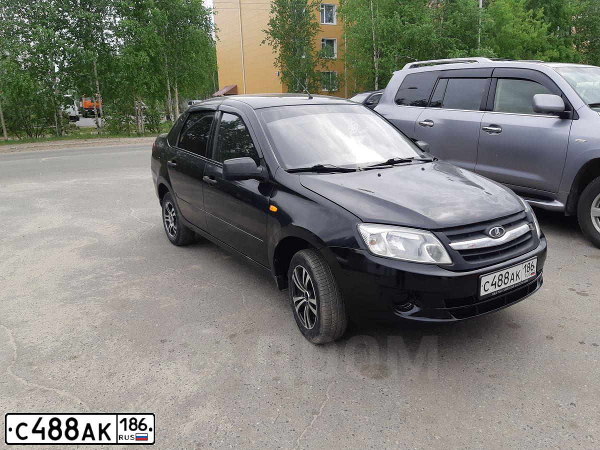 Фото автомобиля LADA 2190 GRANTA, 2014 — госномер Е563КМ186. Цвет: ЧЕРНЫЙ