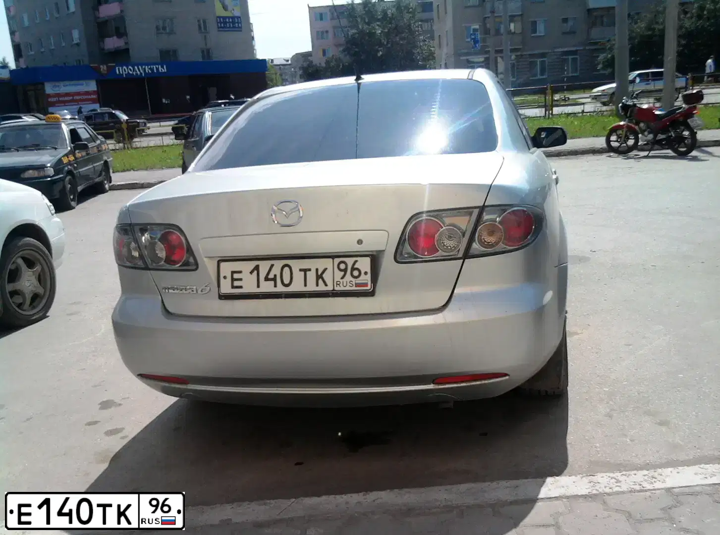 Фото автомобиля MAZDA 6, 2007 — госномер Е140ТК96. Цвет: СВЕТЛО-СЕРЫЙ