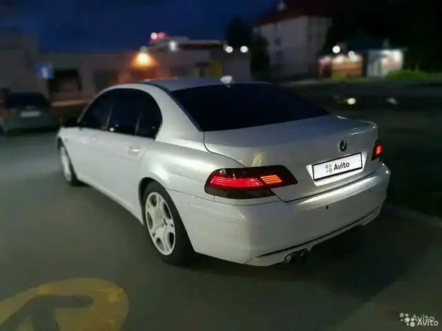 Фото автомобиля BMW 745 L, 2005 — госномер А148УС172. Цвет: Белый
