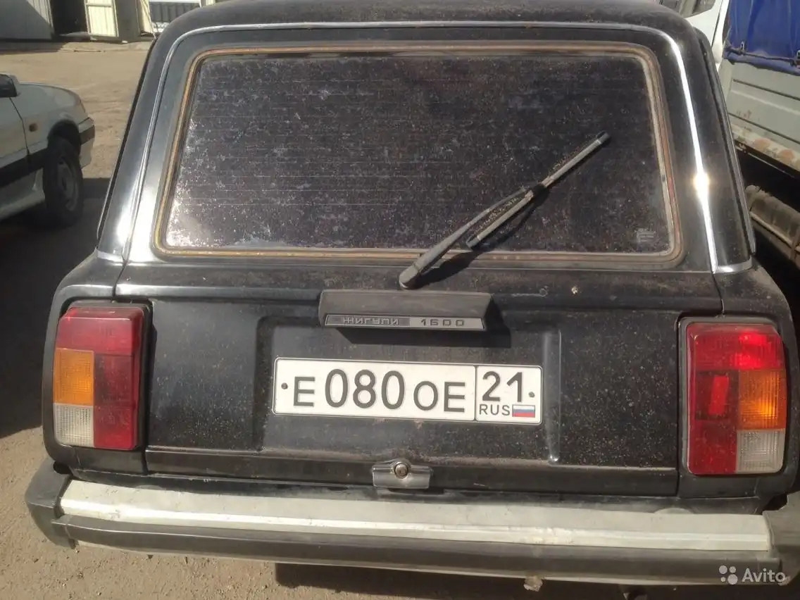 Фото автомобиля LADA 2104, 1991 — госномер Е080ОЕ21. Цвет: ЧЕРНЫЙ