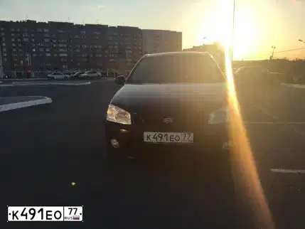 Фото автомобиля KIA CERATO, 2004 — госномер К491ЕО77. Цвет: ЧЕРНЫЙ