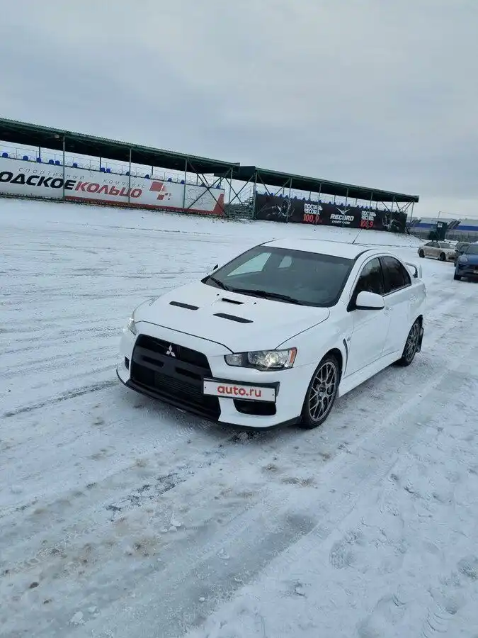 Фото автомобиля MITSUBISHI LANCER, 2008 — госномер С911СС99. Цвет: Белый