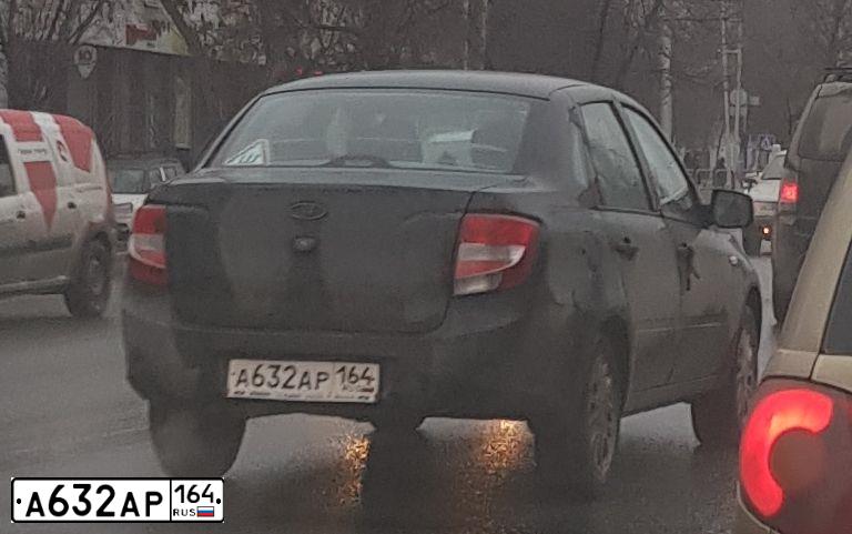 Фото автомобиля LADA 2190 GRANTA, 2014 — госномер К375АР164. Цвет: Сине-Черный