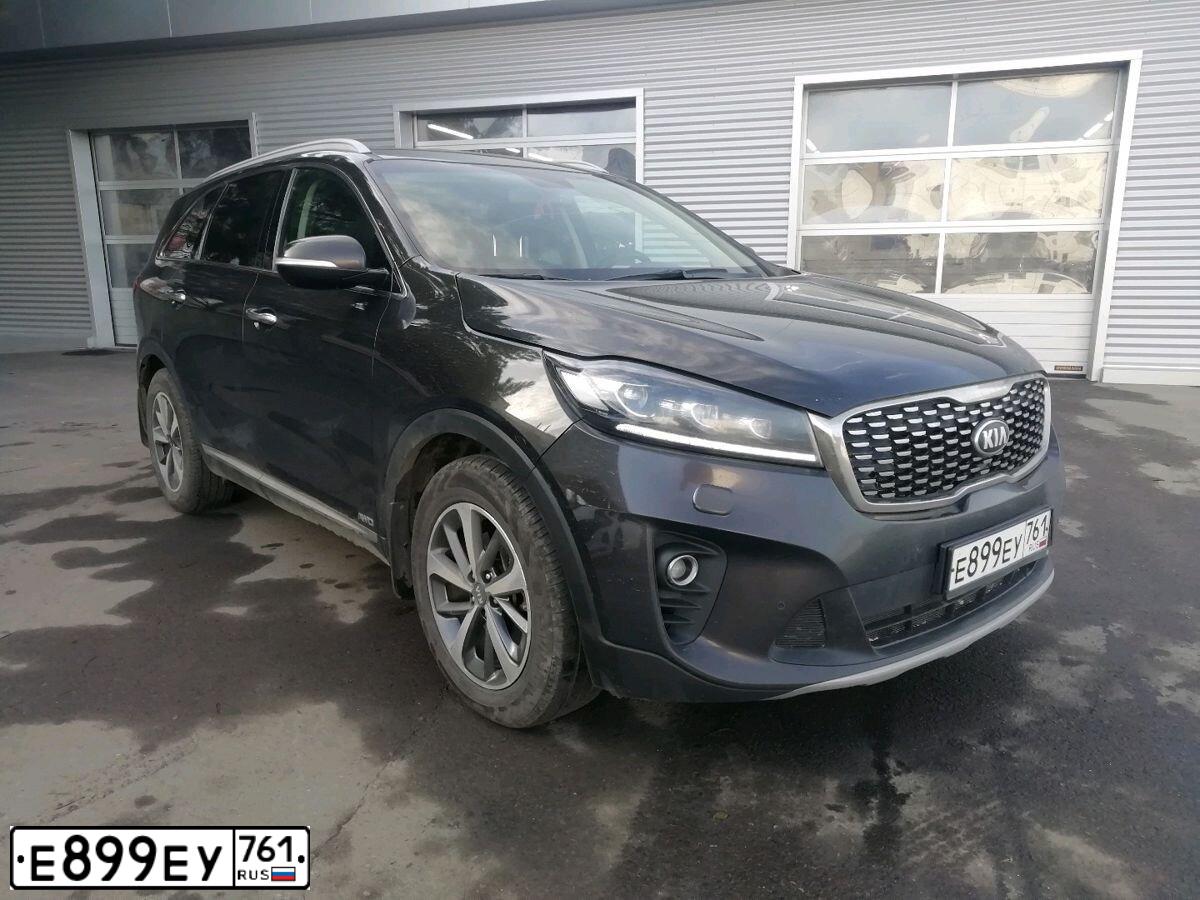 Фото автомобиля KIA SORENTO, 2018 — госномер В002ТС161. Цвет: Коричневый