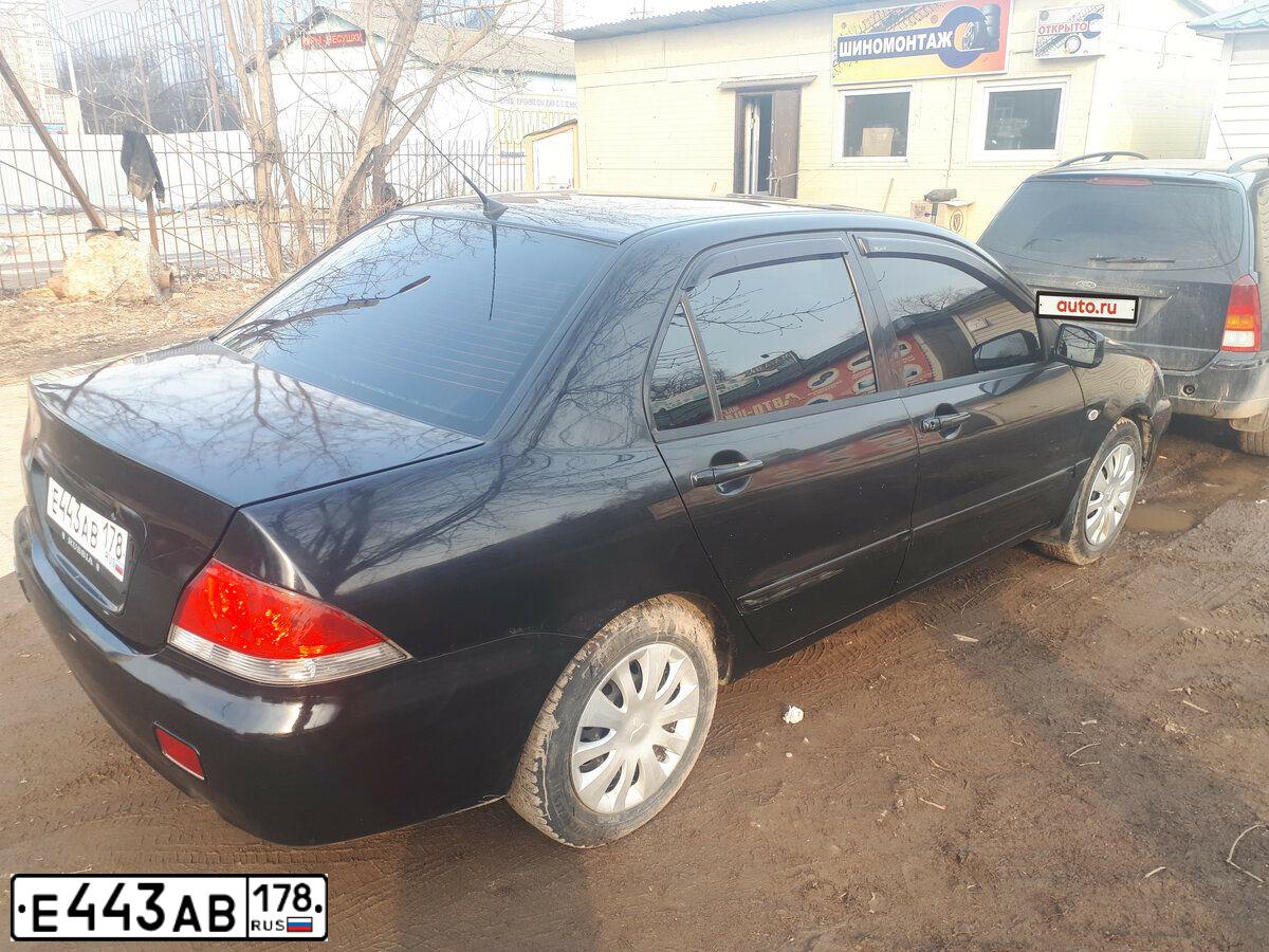 Фото автомобиля MITSUBISHI LANCER, 2006 — госномер Х900СХ74. Цвет: ЧЕРНЫЙ