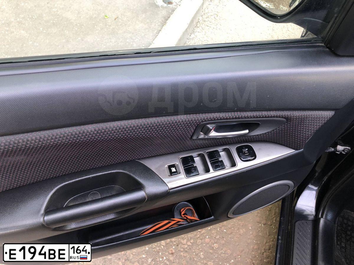 Фото автомобиля KIA SPORTAGE, 2013 — госномер Е194ВЕ164. Цвет: Коричневый