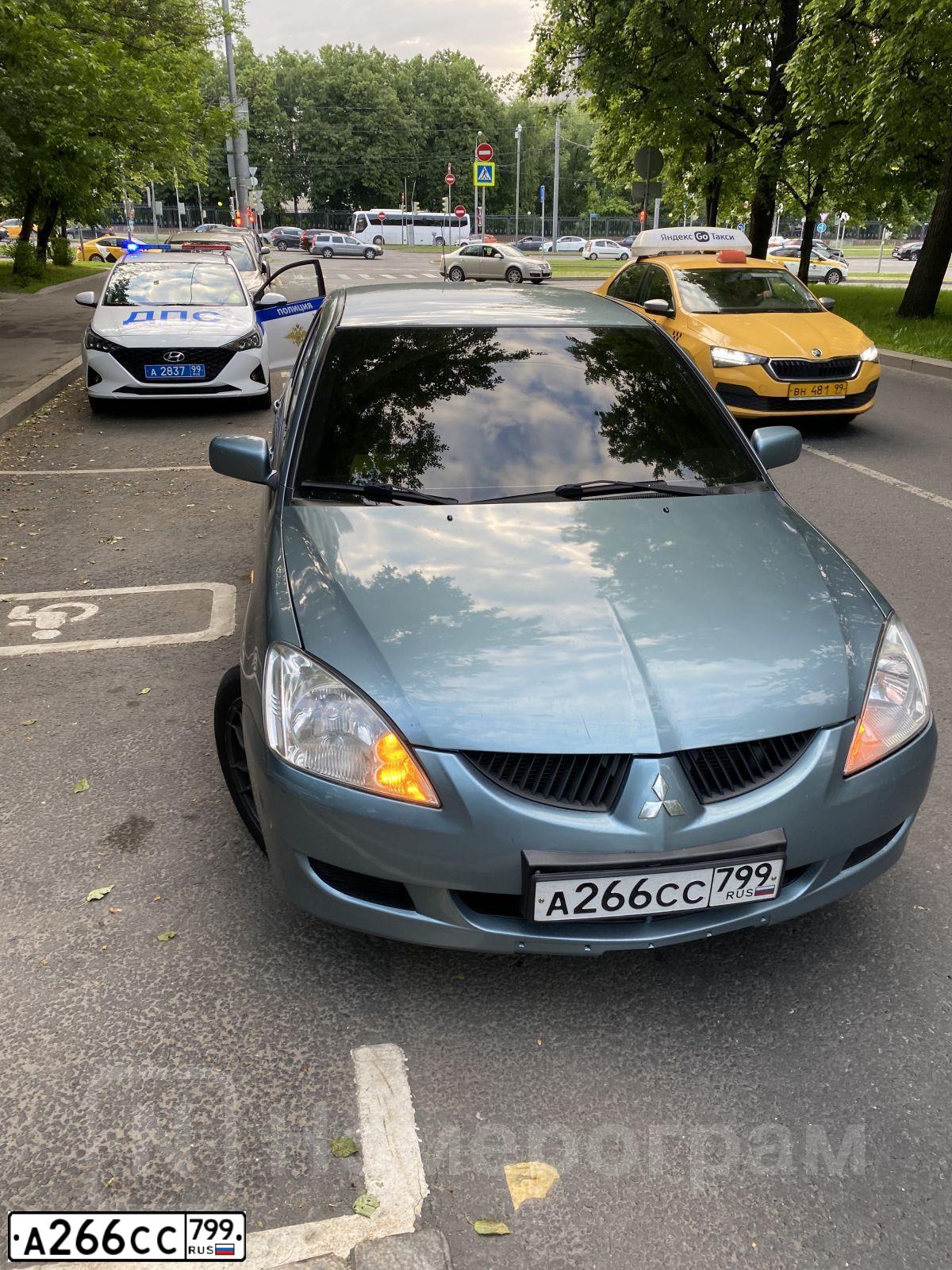 Фото автомобиля MITSUBISHI LANCER, 2009 — госномер Е343ОТ797. Цвет: ЗЕЛЕНЫЙ