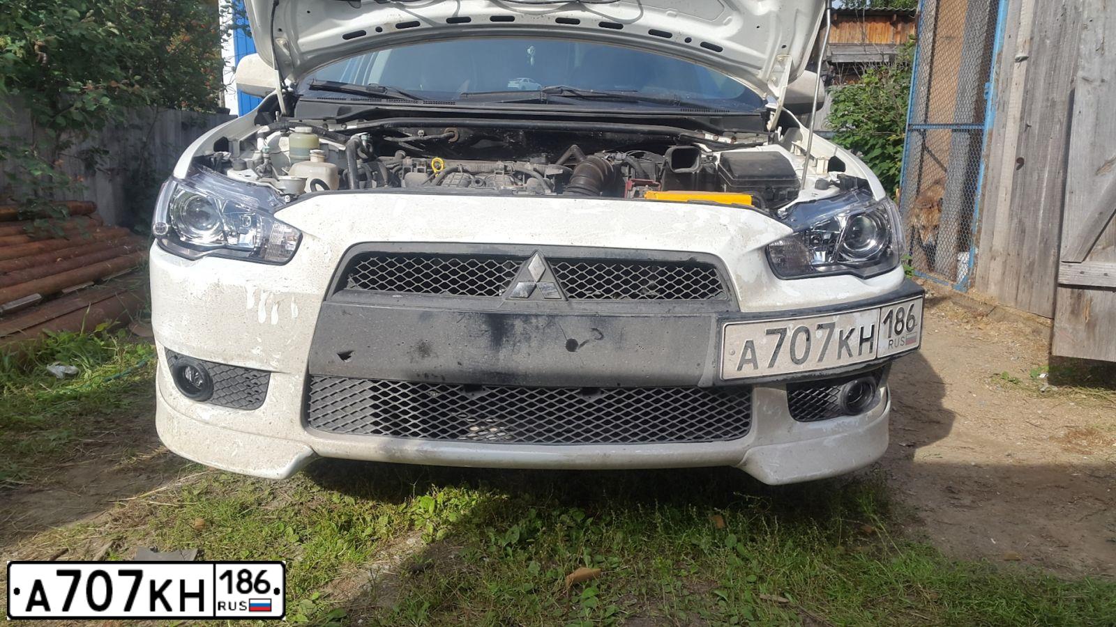 Фото автомобиля MITSUBISHI LANCER, 2008 — госномер А707КН186. Цвет: Белый