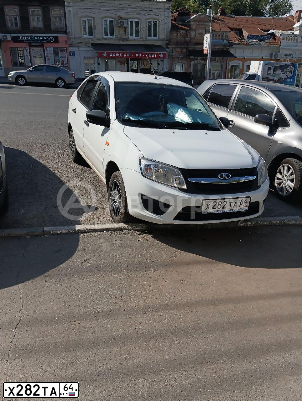 Фото автомобиля LADA 2191 GRANTA, 2014 — госномер Х282ТА64. Цвет: БЕЛЫЙ