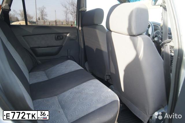 Фото автомобиля DAEWOO NEXIA, 2010 — госномер Е772ТК36. Цвет: Серебристый