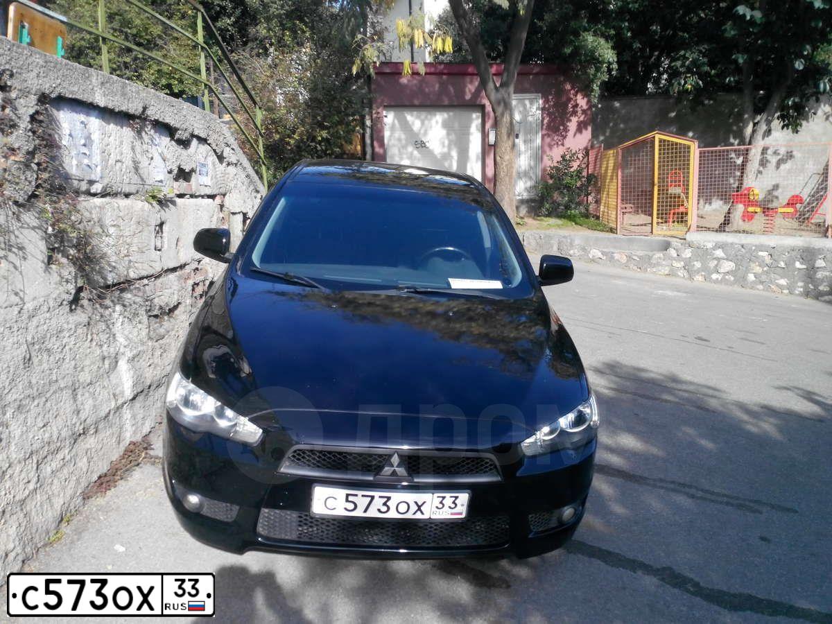 Фото автомобиля MITSUBISHI LANCER, 2008 — госномер Е046НН82. Цвет: ЧЕРНЫЙ