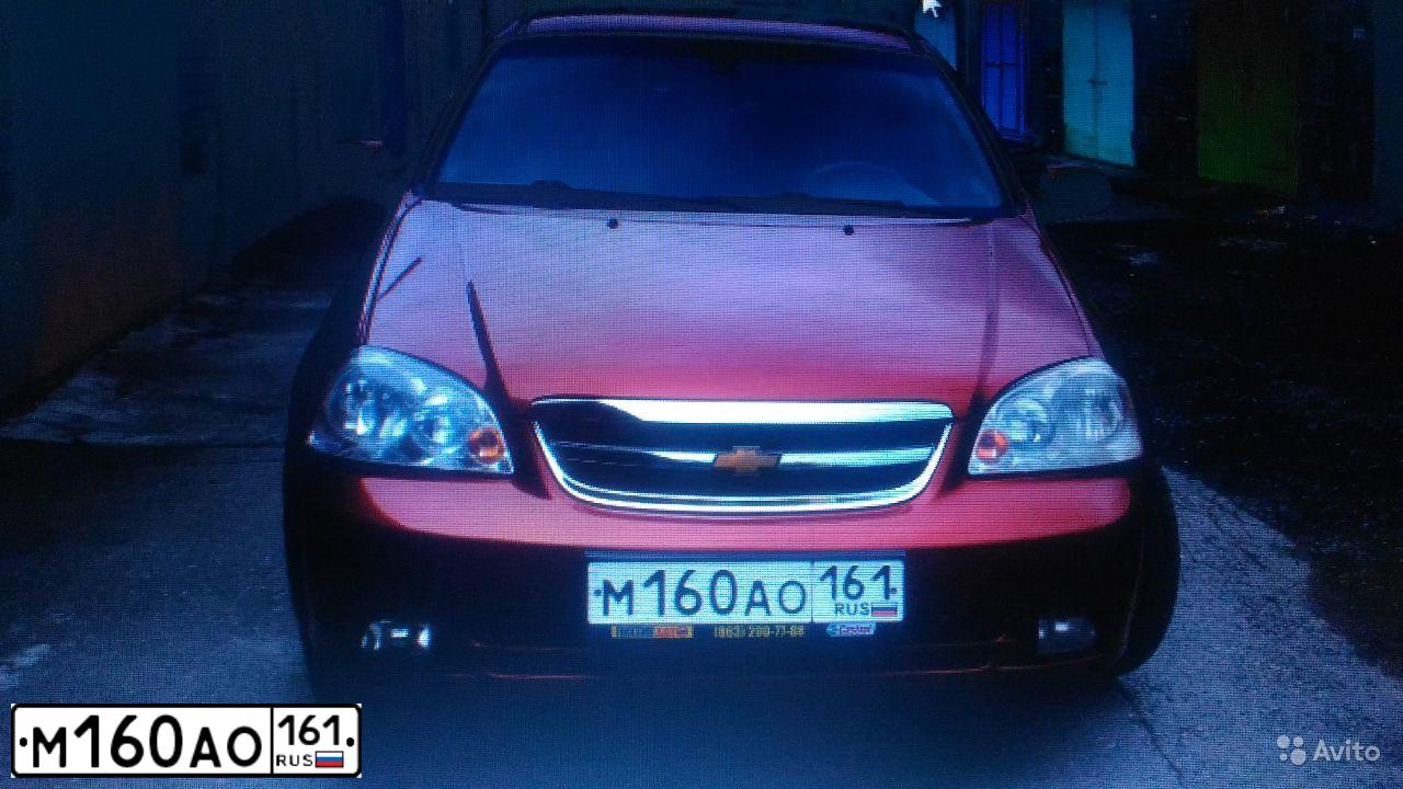 Фото автомобиля CHEVROLET T LACETTI, 2007 — госномер В413АЕ761. Цвет: ТЕМНО-КРАСНЫЙ