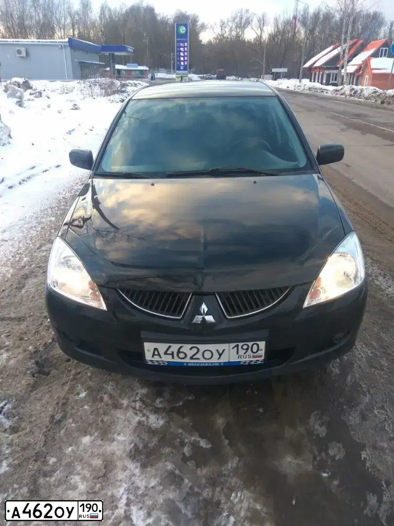 Фото автомобиля MITSUBISHI LANCER, 2005 — госномер О112АВ177. Цвет: ЧЕРНЫЙ